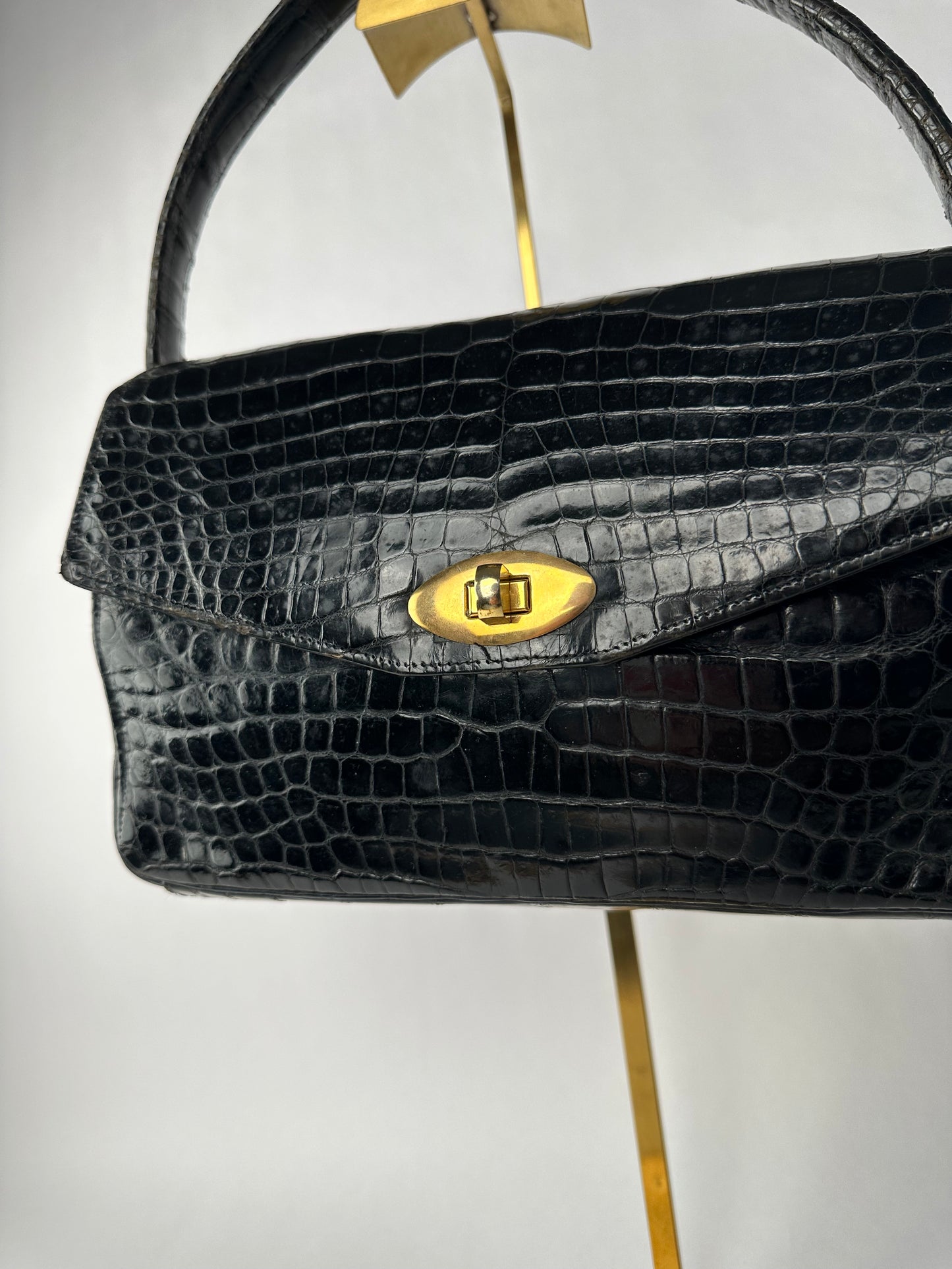 ANONYMOUS black exotic leather bag with shoulder strap and gold buckle