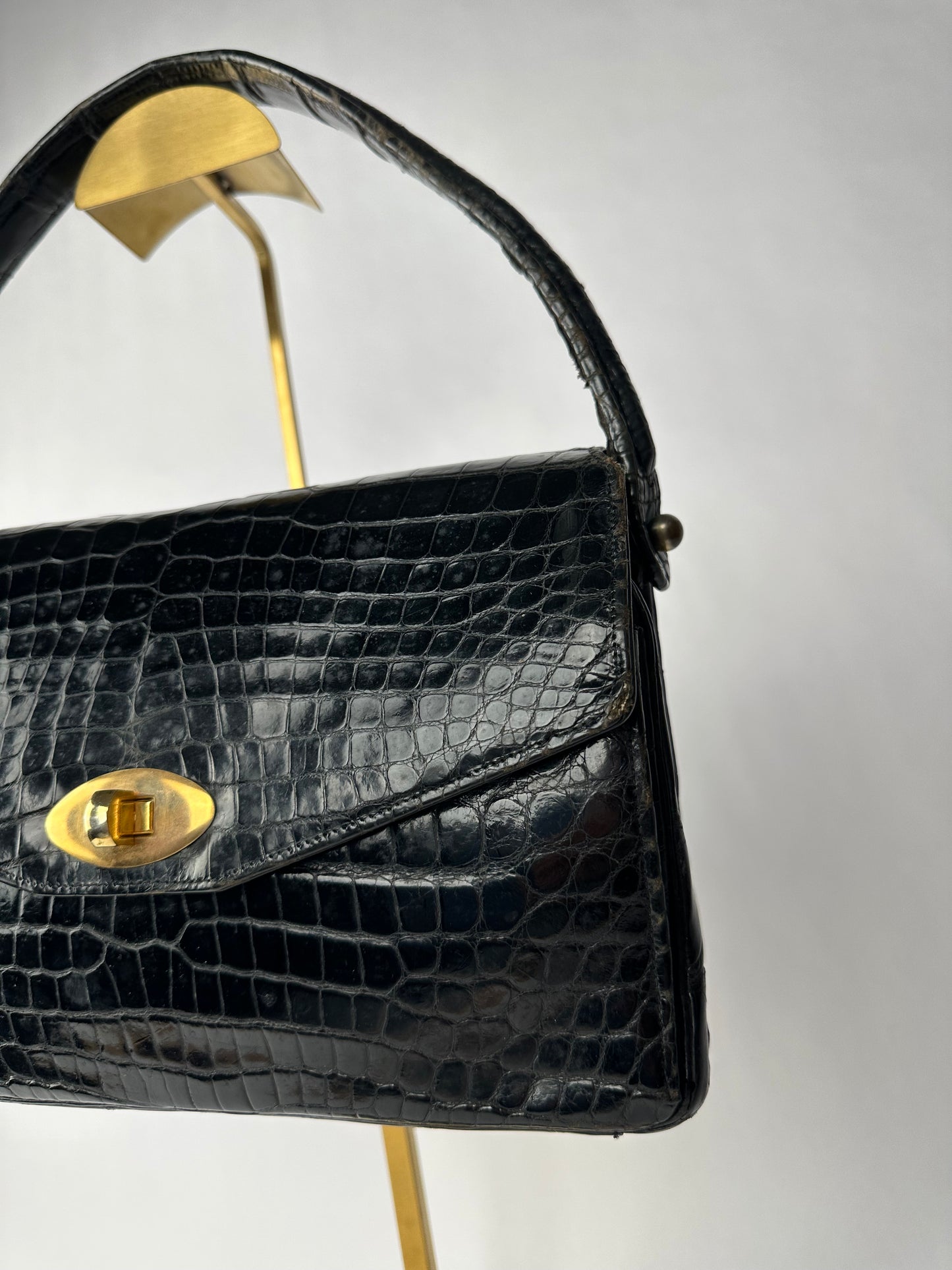 ANONYMOUS black exotic leather bag with shoulder strap and gold buckle