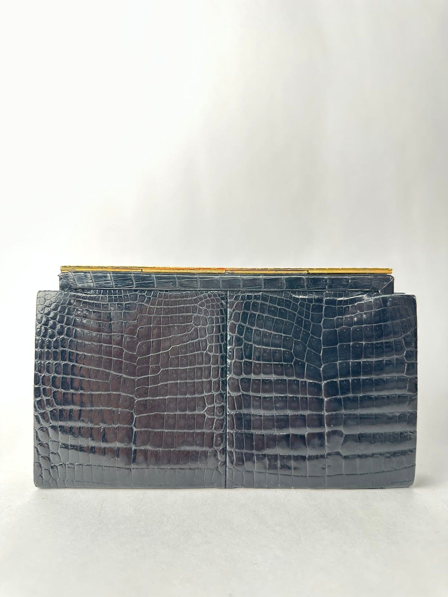 ANONYMOUS black exotic leather clutch bag with gold-plated metal clasp