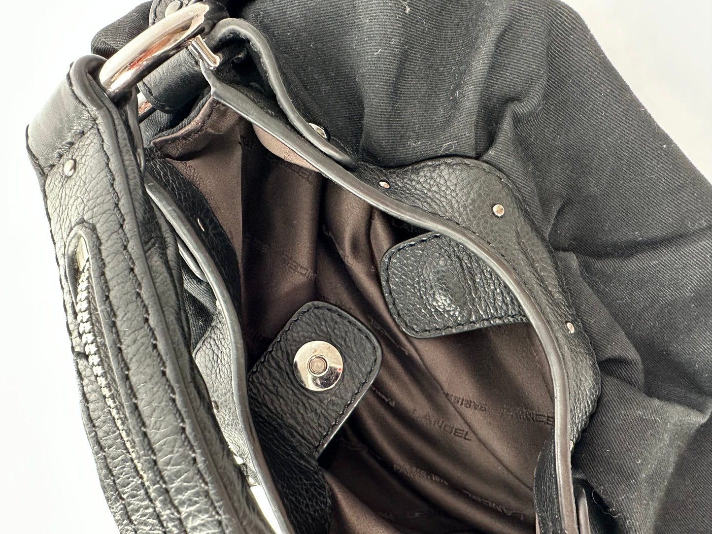 LANCEL small bag in cotton canvas and black grained leather decorated with a bell bag jewel and a signed coin, zipped handle.