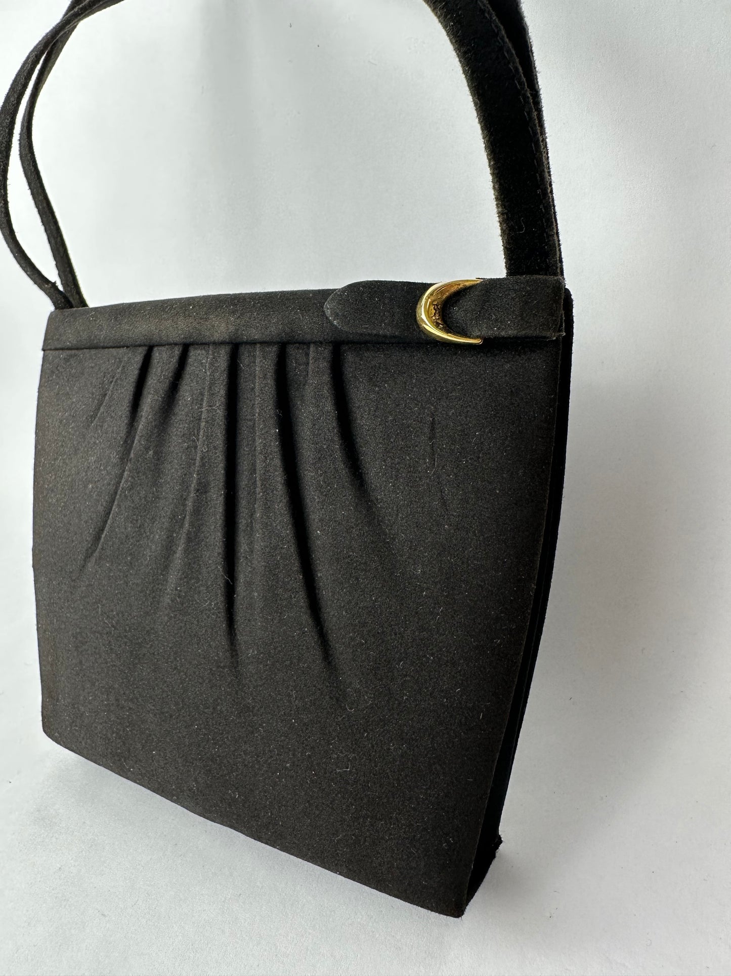 ANONYMOUS black suede with golden poudrier