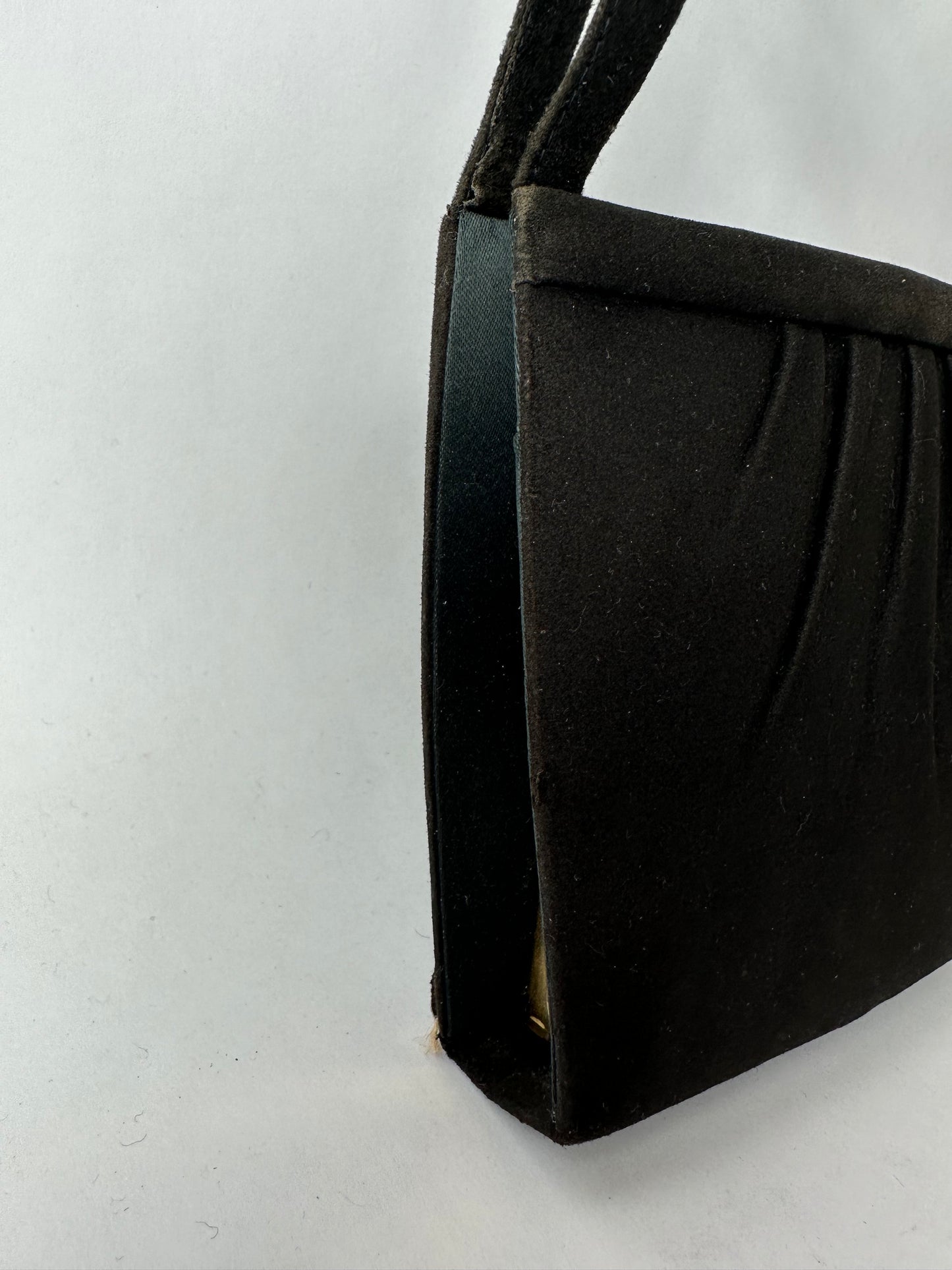 ANONYMOUS black suede with golden poudrier