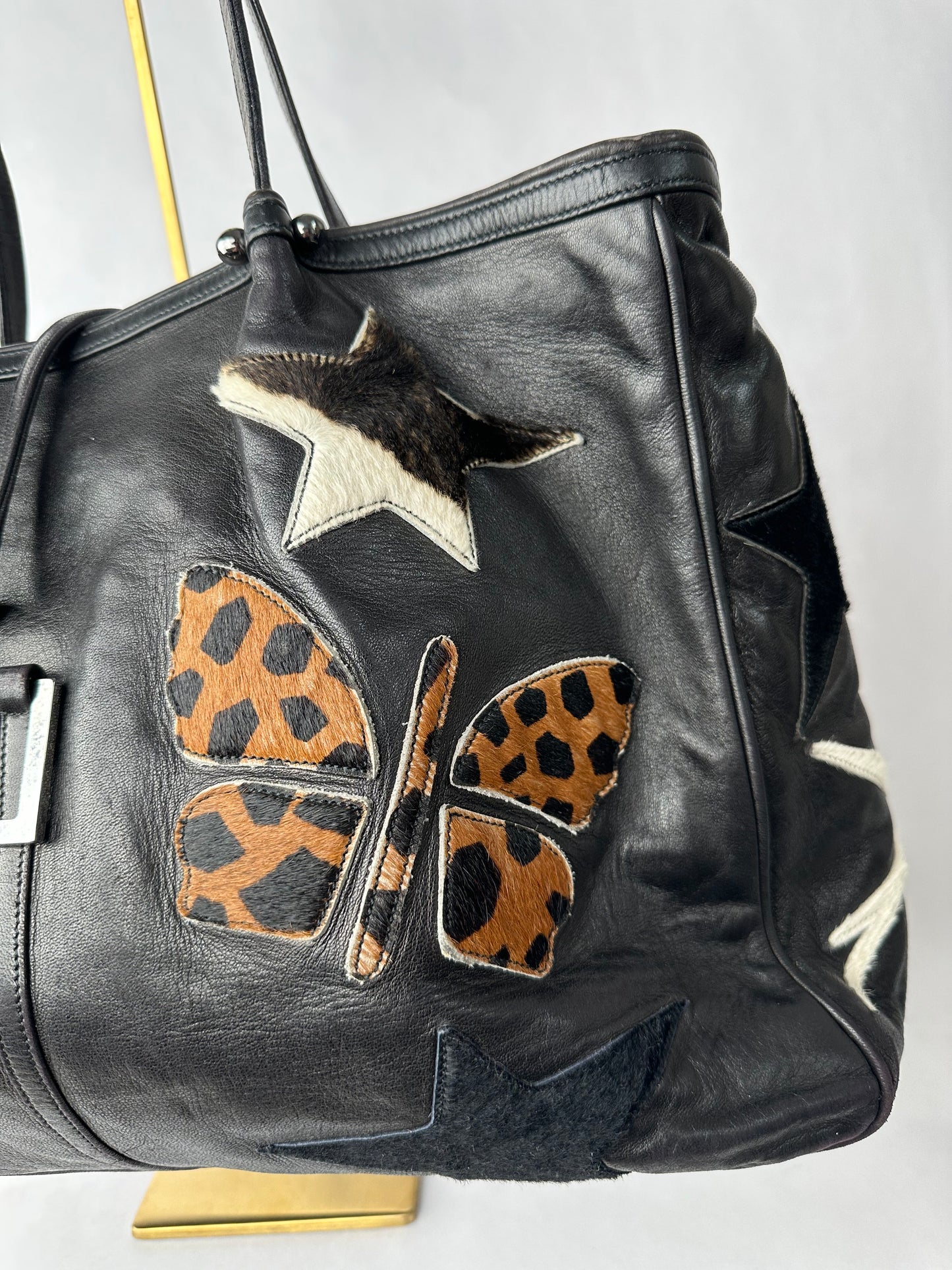 RENAUD PELLEGRINO leather tote bag with fur shape cutouts