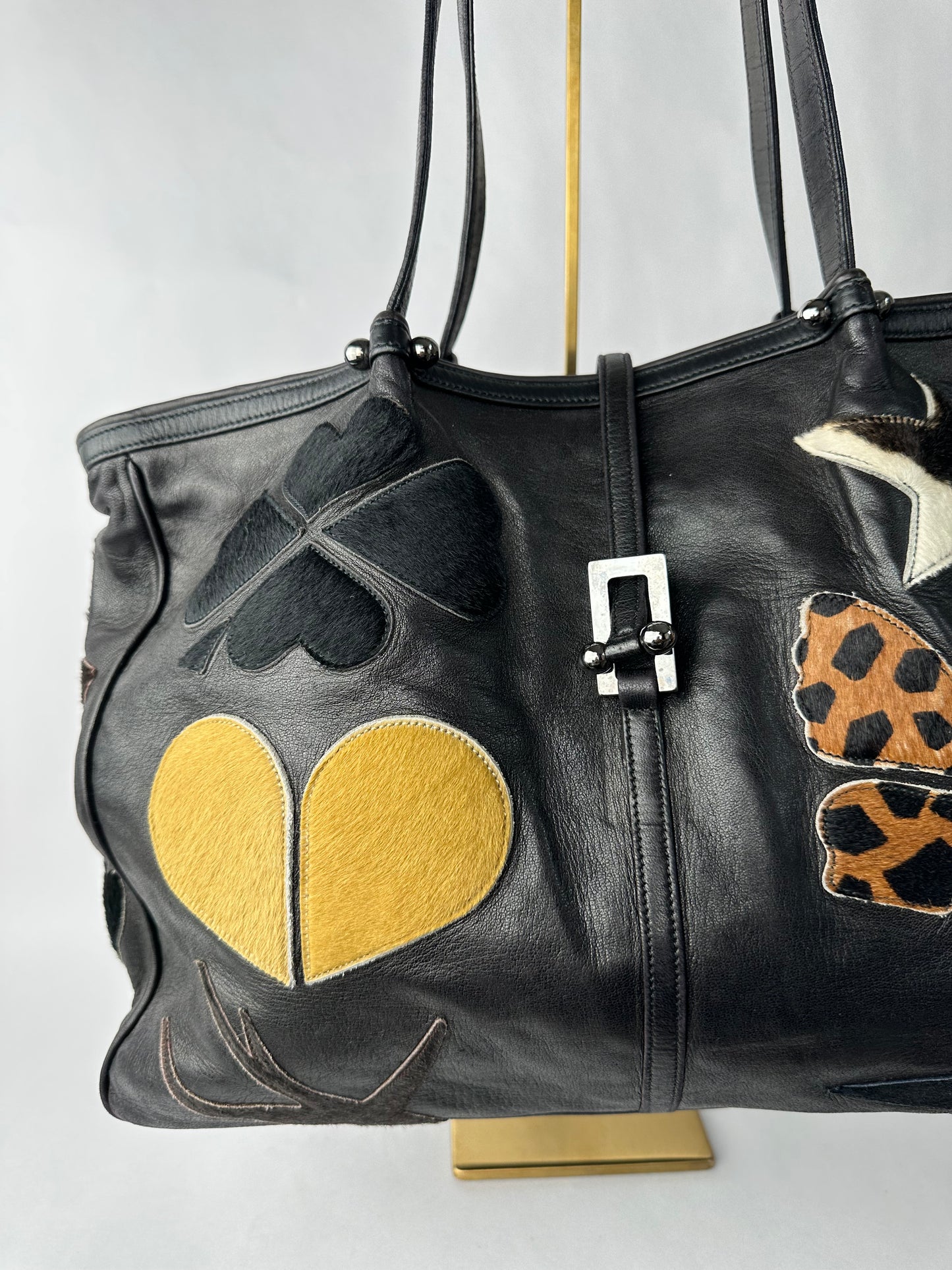 RENAUD PELLEGRINO leather tote bag with fur shape cutouts
