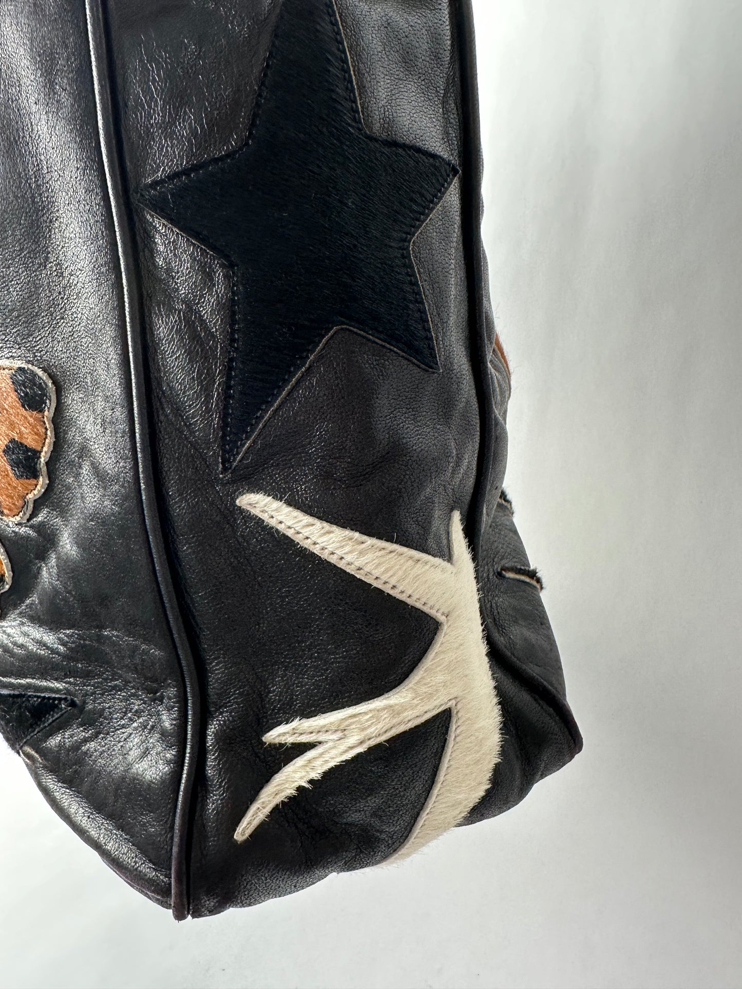 RENAUD PELLEGRINO leather tote bag with fur shape cutouts