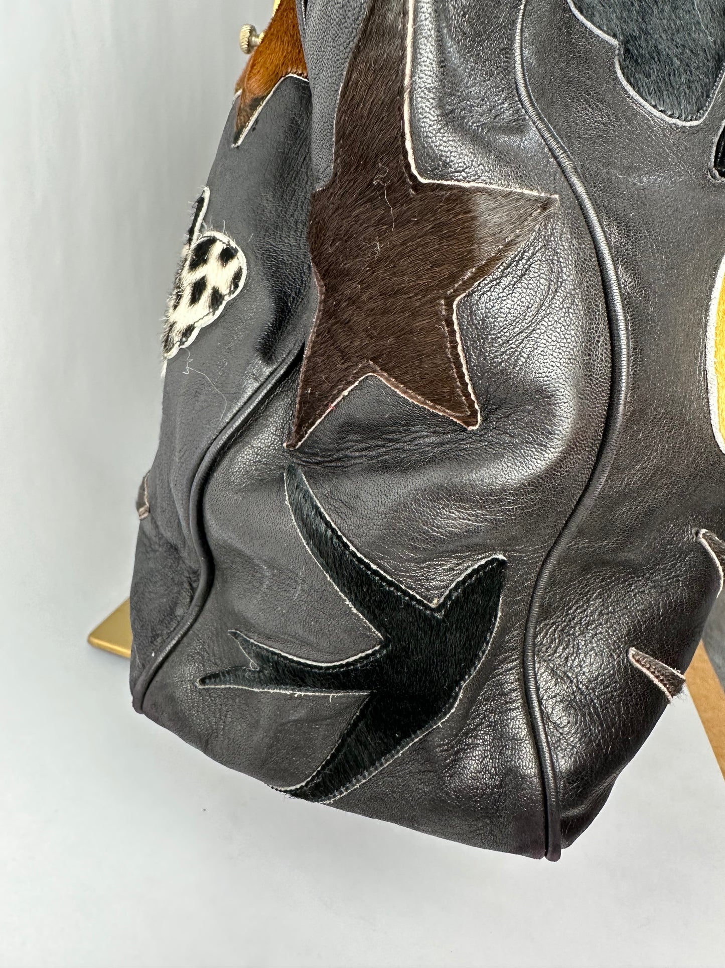 RENAUD PELLEGRINO leather tote bag with fur shape cutouts