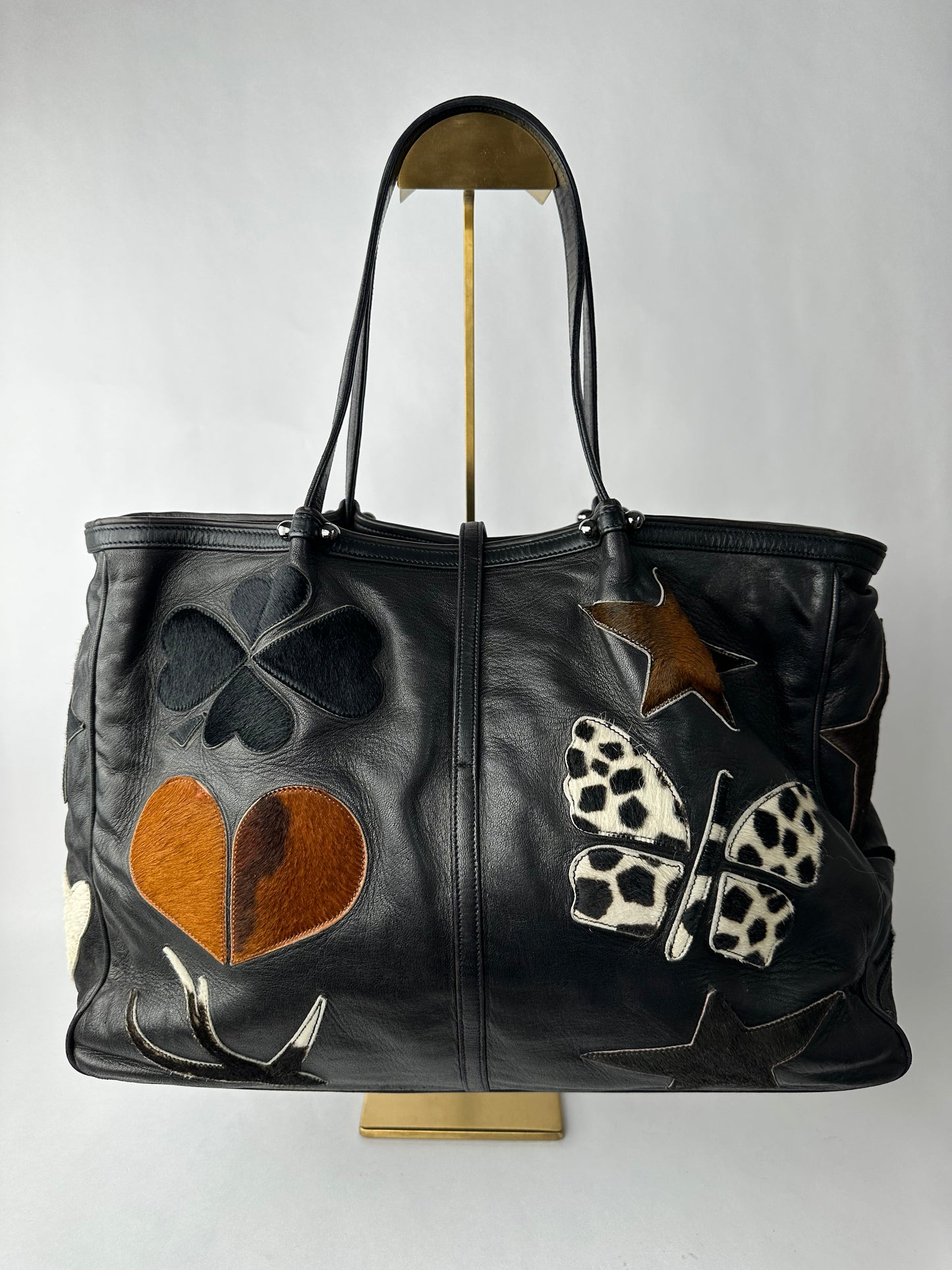 RENAUD PELLEGRINO leather tote bag with fur shape cutouts
