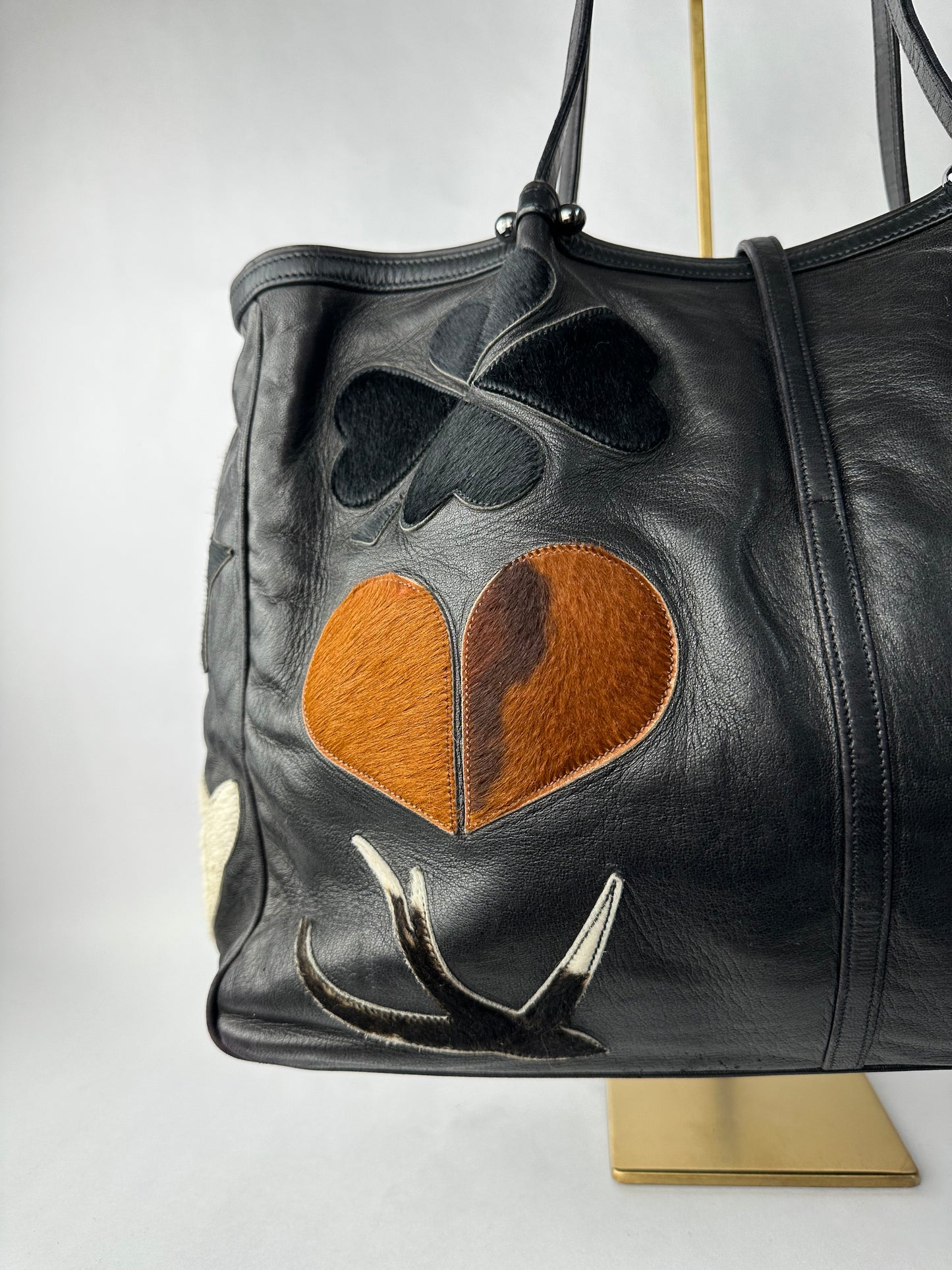 RENAUD PELLEGRINO leather tote bag with fur shape cutouts