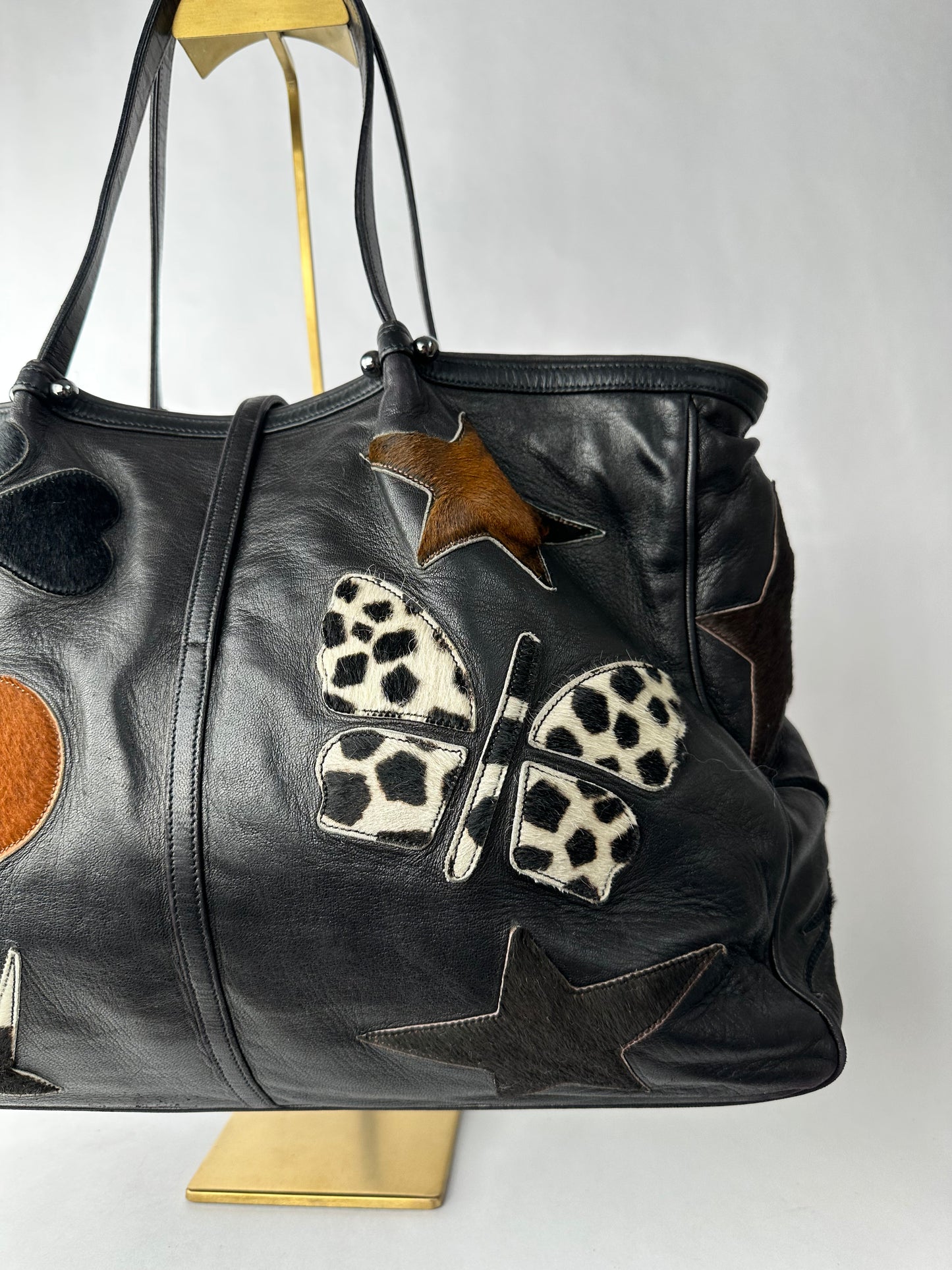 RENAUD PELLEGRINO leather tote bag with fur shape cutouts