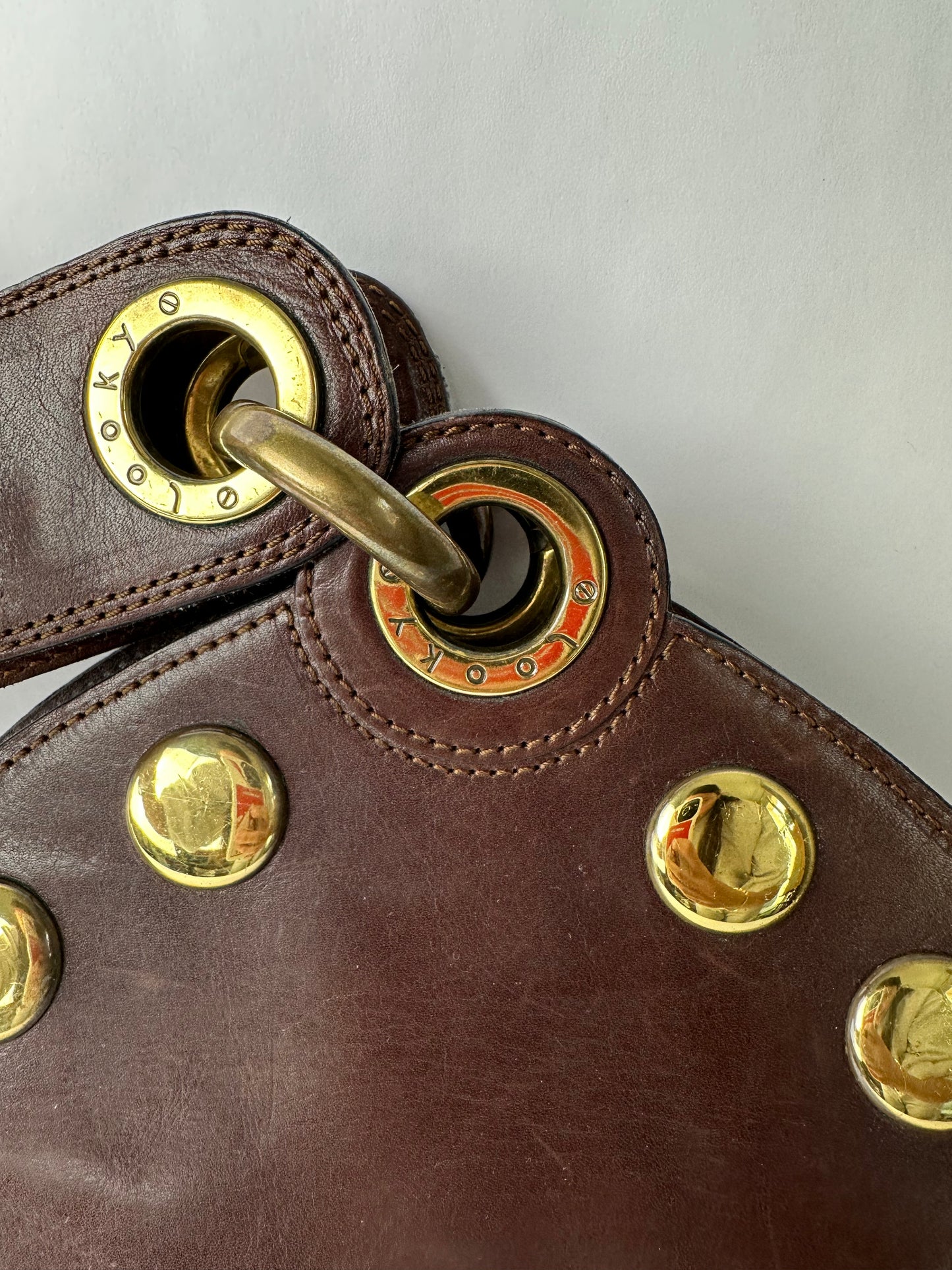 ANONYMOUS brown leather and gold stud bag