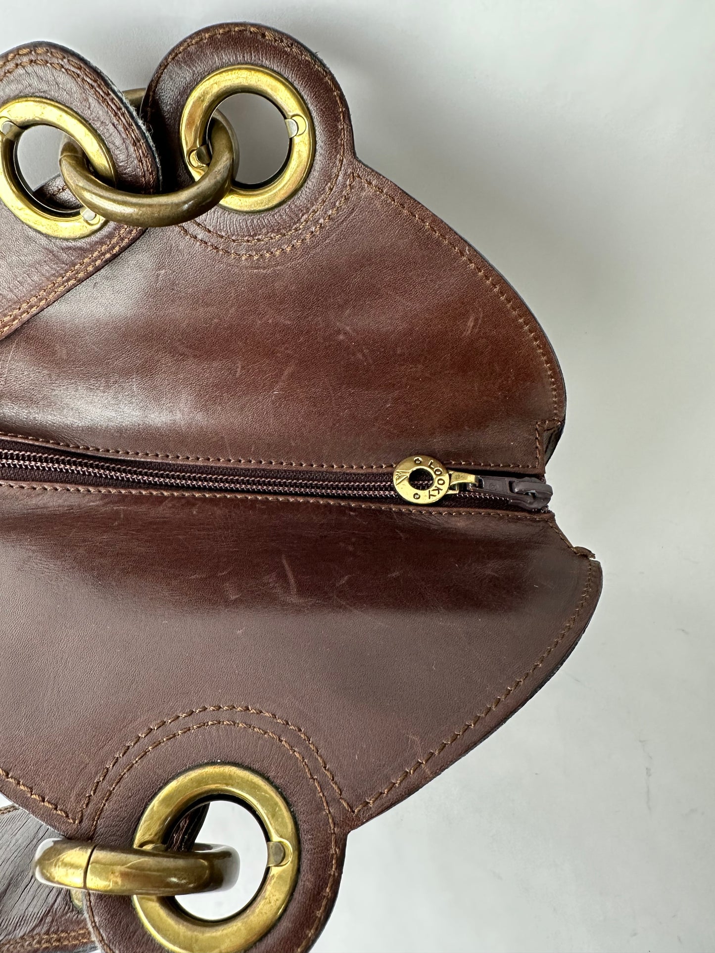 ANONYMOUS brown leather and gold stud bag