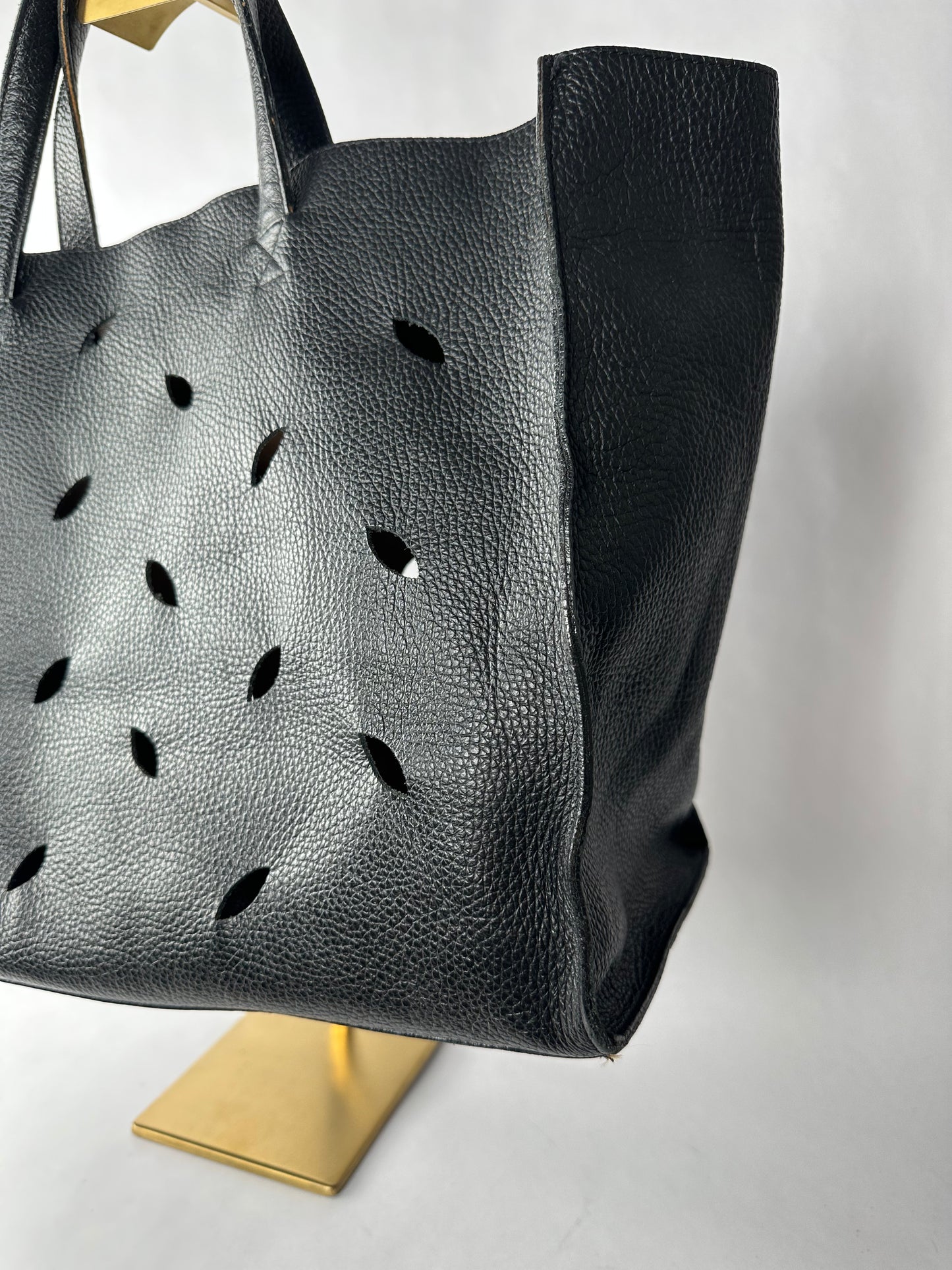 PIERRE HERME bag in black grained cowhide with openwork leaf motifs