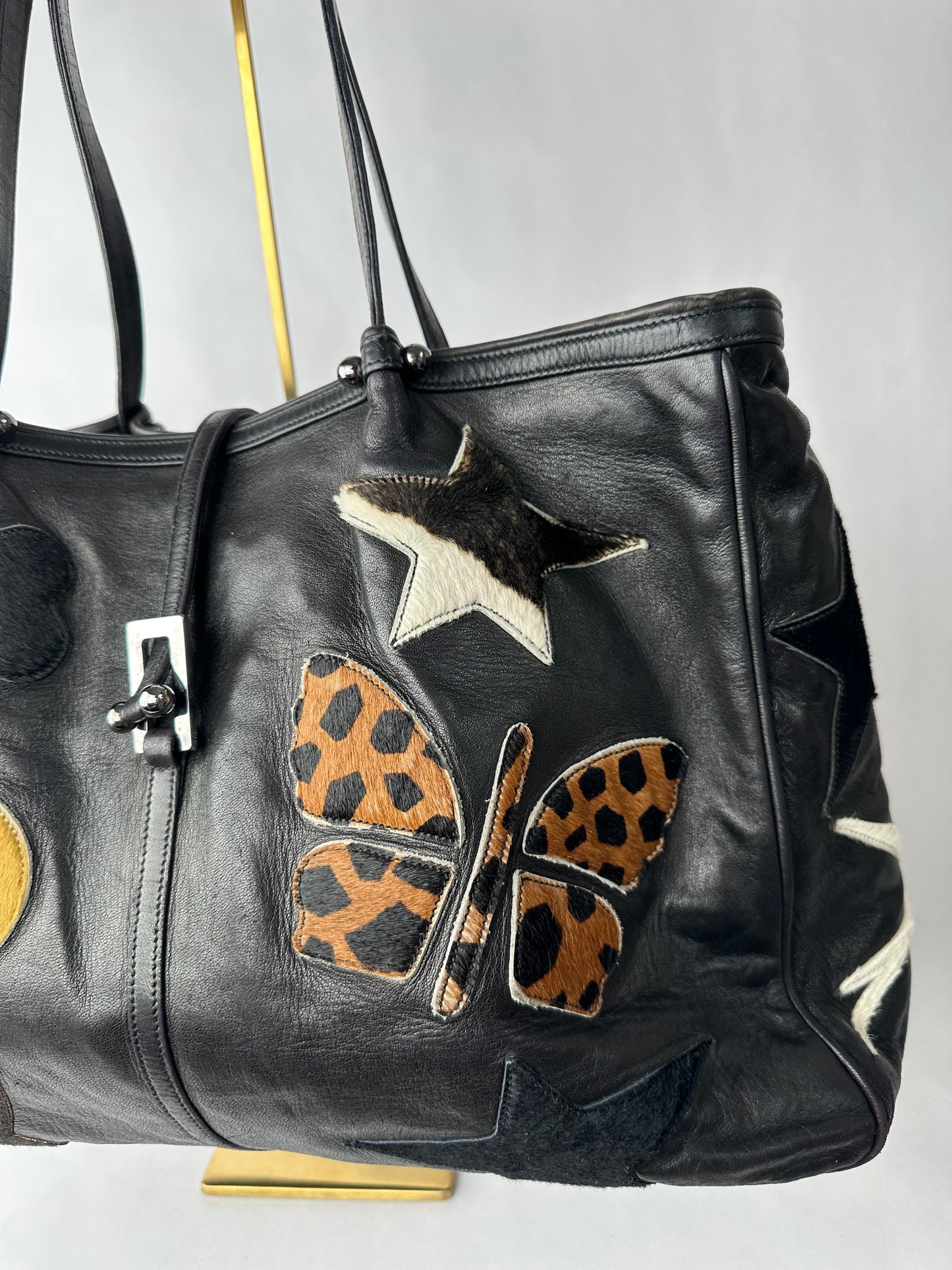 RENAUD PELLEGRINO leather tote bag with fur shape cutouts